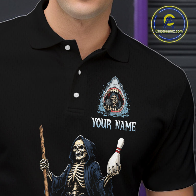 A close-up of a person wearing a black polo shirt with a custom graphic print. The print features a shark with a skeleton inside and a grim reaper holding a bowling pin, with the text 'YOUR NAME' below the shark.