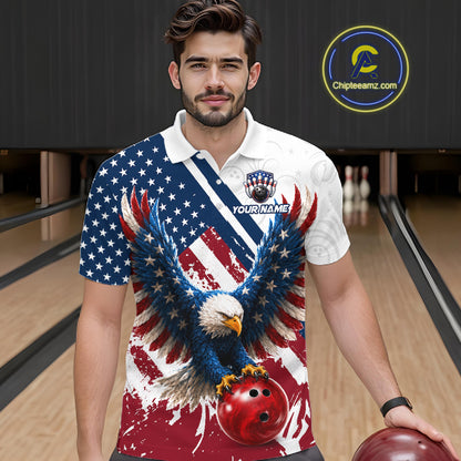 A man wearing a custom short-sleeve bowling polo shirt with a patriotic eagle and American flag design, standing in a bowling alley. The shirt features a bald eagle holding a red bowling ball over an American flag pattern, with a white collar and a customizable name patch on the chest.