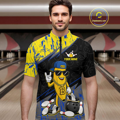 Man wearing a colorful bowling shirt with cartoon character design in a bowling alley.