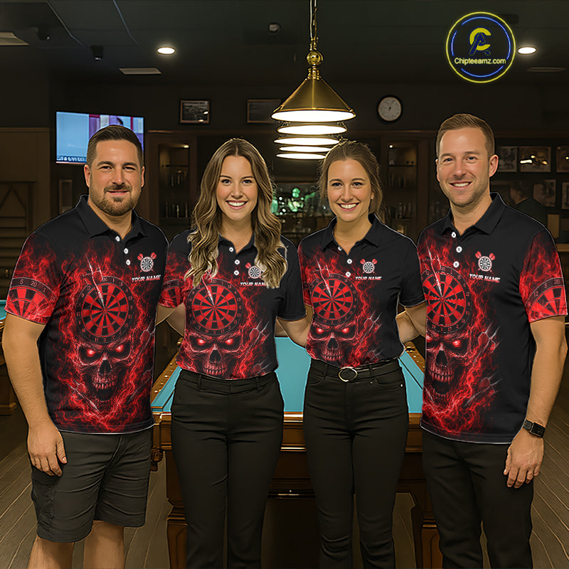 Four people standing together in a dimly lit bar or gaming room, wearing matching black polo shirts with a red and black skull-and-dartboard graphic print. The shirts have a small crest logo on the chest and the text 'ChipteeAmz' visible near the bottom right of the print.