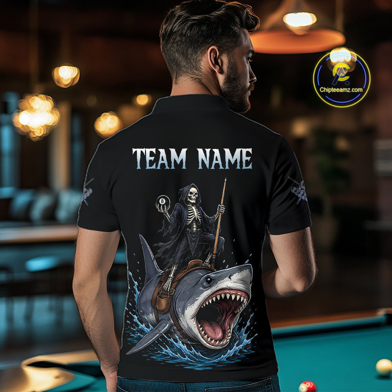 Man wearing a black t-shirt with a graphic design of a skeleton on a shark, with 'TEAM NAME' text, in an indoor setting.
