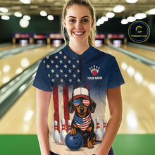 Load image into Gallery viewer, Person wearing a blue t-shirt with a dog design and American flag, standing in a bowling alley.