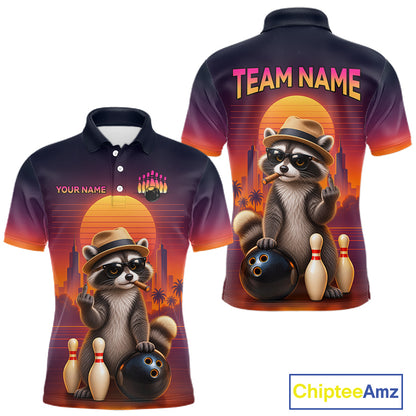 Custom short-sleeve polo shirt shown from the front and back, featuring a cartoon raccoon in a hat holding bowling balls and pins against a sunset skyline. The shirt has a dark-to-orange gradient with 'TEAM NAME' and 'YOUR NAME' text placeholders.
