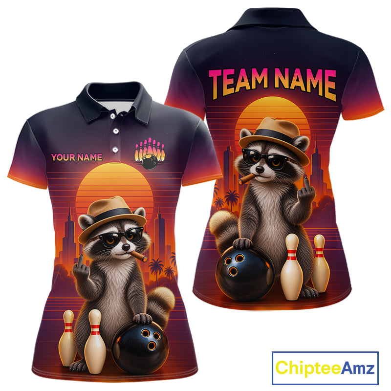 Front and back views of a short-sleeve polo shirt with a colorful retro bowling raccoon graphic, featuring a raccoon in a hat and sunglasses bowling with pins and bowling balls against a sunset background. Includes customizable text placeholders 'TEAM NAME' and 'YOUR NAME'.