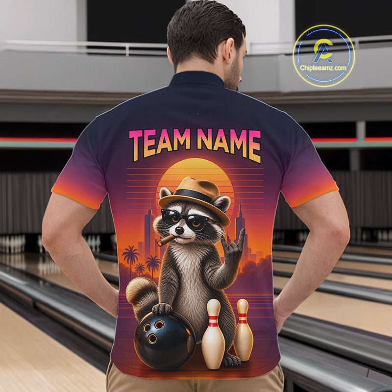 A man viewed from behind wearing a custom bowling-themed short-sleeve button-up shirt with a raccoon graphic and 'TEAM NAME' text, set against a bowling alley background.