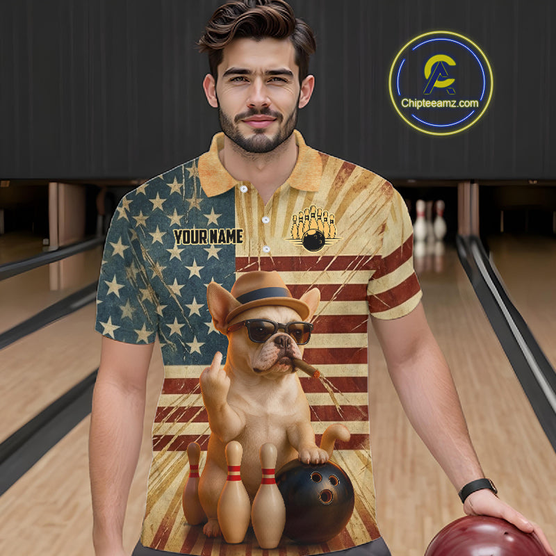 A man wearing a short-sleeve polo shirt with a patriotic American flag design and a cartoon dog wearing a bowler hat and sunglasses, standing in a bowling alley. The shirt has 'YOUR NAME' printed on it, and a 'Chipteeamz.