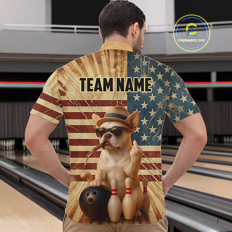 A man viewed from behind wearing a short-sleeve bowling-themed button-up shirt with a patriotic American flag design and a cartoon French bulldog holding a bowling ball. The shirt has 'TEAM NAME' printed across the upper back.