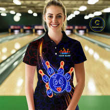 Load image into Gallery viewer, Woman standing in a bowling alley wearing a black neon-style bowling polo shirt with a glowing blue cartoon bowling ball mascot, fiery orange pin graphics, and custom name text.