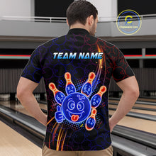 Load image into Gallery viewer, Man standing in a bowling alley wearing a black neon-style bowling quarter zip shirt with a glowing blue cartoon bowling ball mascot, fiery orange pin graphics, and custom team name text.