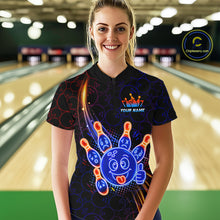 Load image into Gallery viewer, Woman standing in a bowling alley wearing a black neon-style bowling quarter zip shirt with a glowing blue cartoon bowling ball mascot, fiery orange pin graphics, and custom name text.