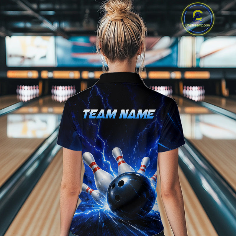 Woman wearing a black and blue bowling quarter zip shirt featuring lightning effects, a large blue bowling ball striking pins, and custom team name text.