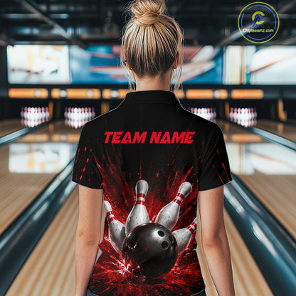 Woman wearing a black bowling polo shirt with dramatic red splatter graphics, a large black bowling ball, and flying pins, plus custom player name text.