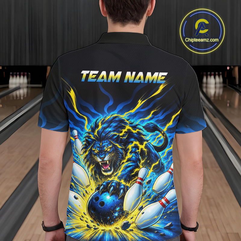 A man viewed from behind wearing a black short-sleeve bowling shirt with a vivid blue and yellow electric lion graphic on the back, bowling pins, and the text 'TEAM NAME'. Bowling lanes are visible in the background, and a circular 'Chipteamz.