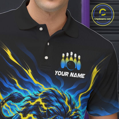 A close-up of a man wearing a black short-sleeve polo shirt with a bowling-themed graphic print. The shirt features a blue and yellow flame design at the bottom, a bowling pins and ball graphic above the customizable white text 'YOUR NAME'.