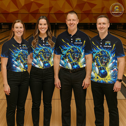 Four people standing in a bowling alley, shown from the back, wearing matching dark navy bowling shirts with a large blue and yellow roaring lion graphic and the text 'YOUR NAME' across the shoulders and upper back.