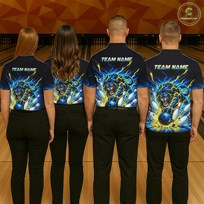 Four people standing in a bowling alley, shown from the back, wearing matching dark navy bowling shirts with a large blue and yellow roaring lion graphic and the text 'TEAM NAME' across the shoulders and upper back.