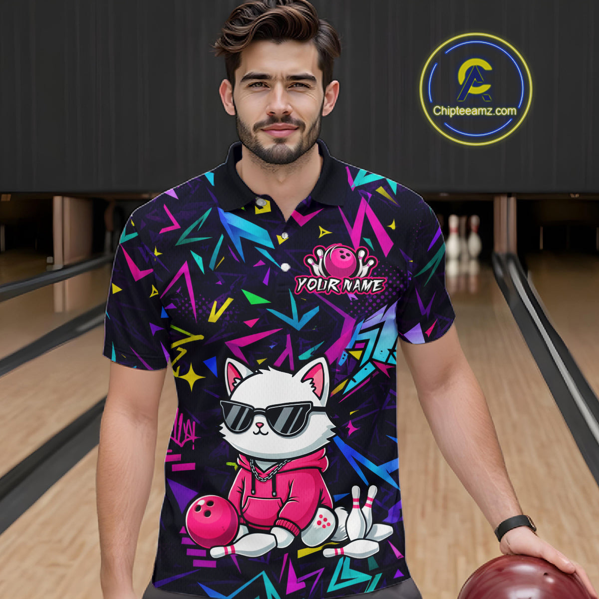Man wearing a black bowling polo with neon geometric patterns, custom team text, and a white cat mascot in sunglasses holding a pink bowling ball.