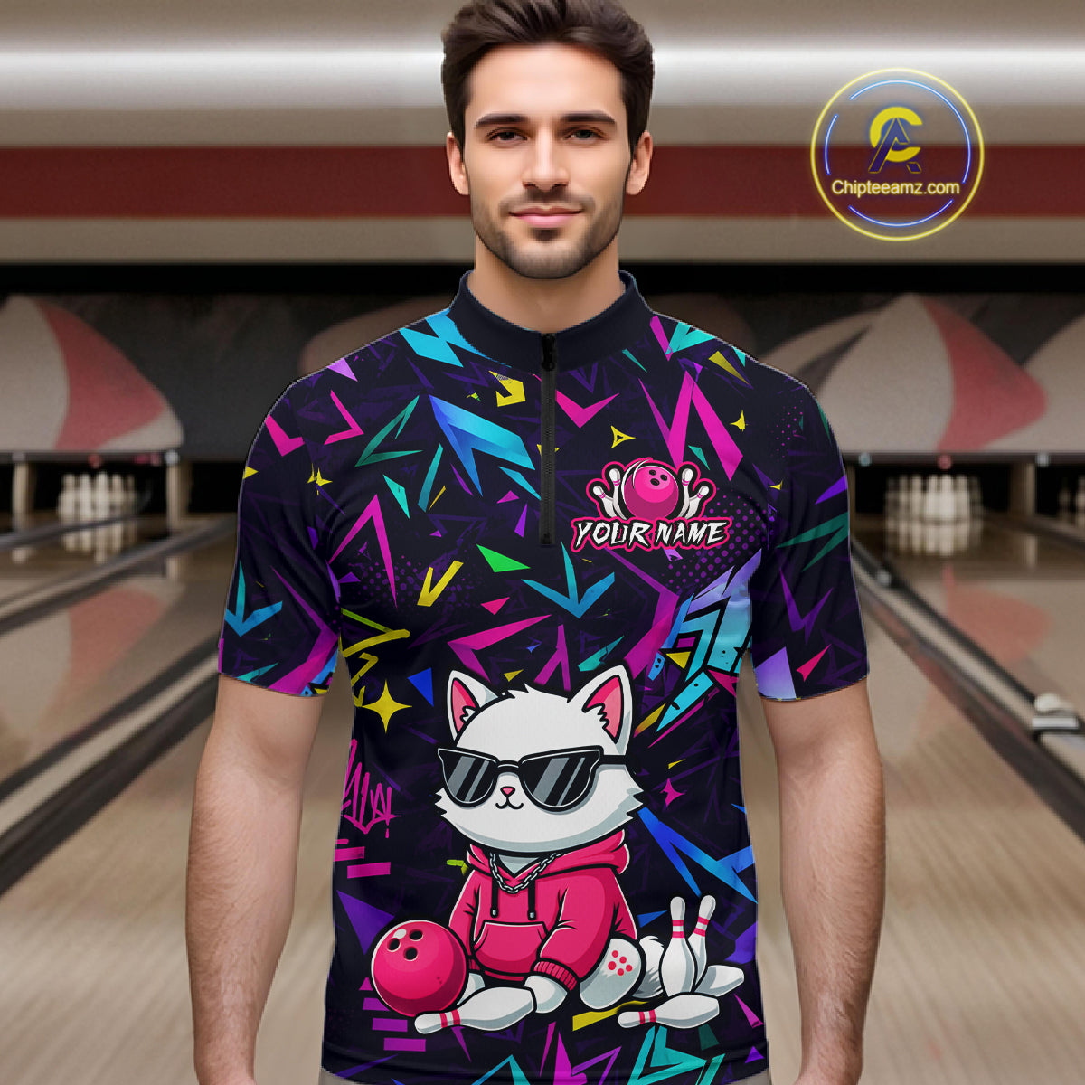 Man wearing a black bowling quarter zip with neon geometric patterns, custom team text, and a white cat mascot in sunglasses holding a pink bowling ball.