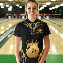 Load image into Gallery viewer, Women wearing personalized bowling quarter zip shirt with a crowned bowling ball centered among geometric gold patterns across a black layout.