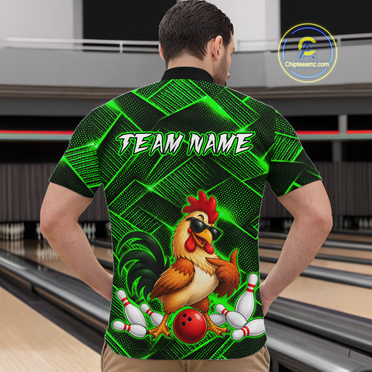 Man wearing a green and black bowling  quarter zip shirt featuring a cool rooster mascot wearing sunglasses, a red bowling ball, bowling pins, and custom team name text.