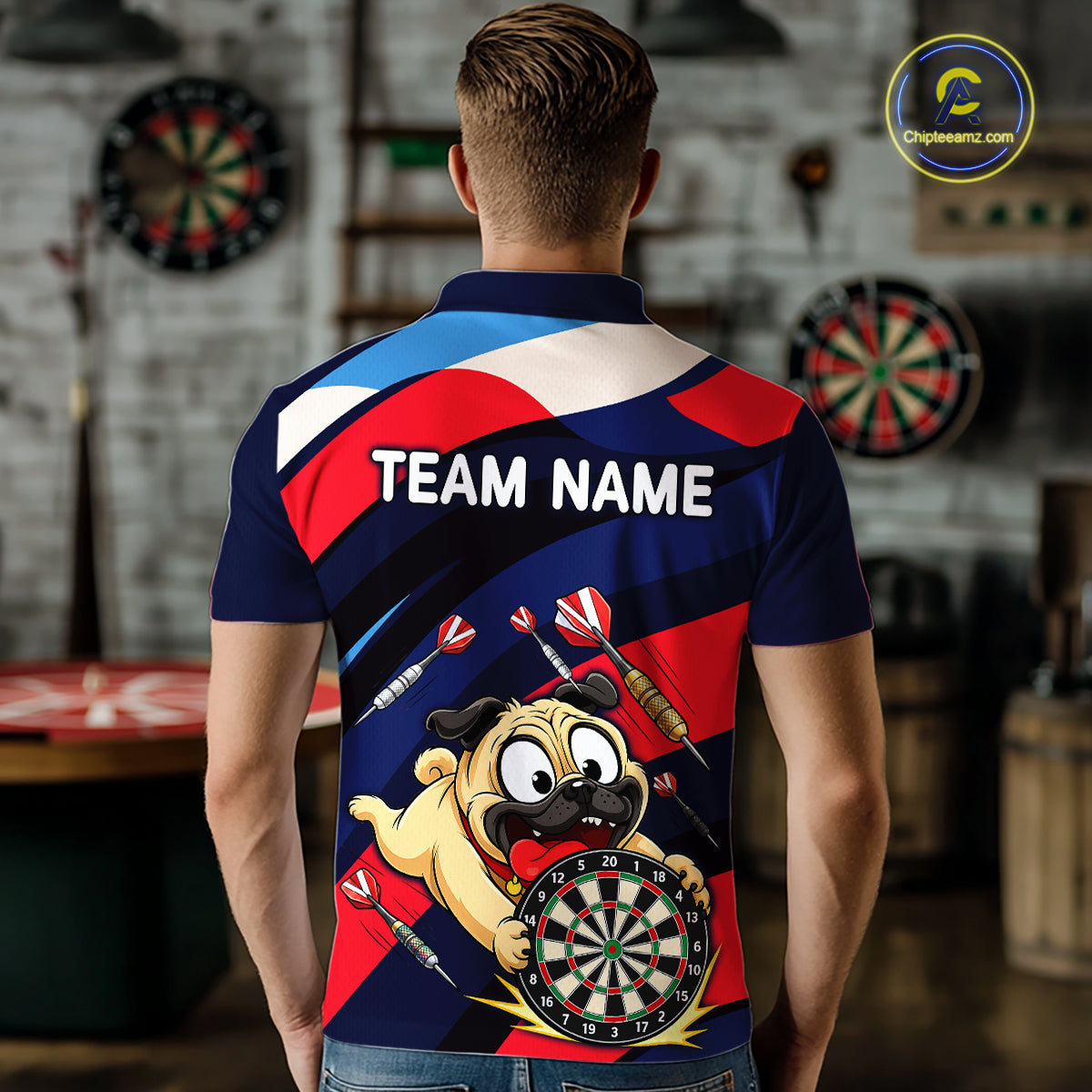 Person wearing a navy, red, and white darts polo featuring a cartoon pug holding a dartboard, flying darts, and custom team text.