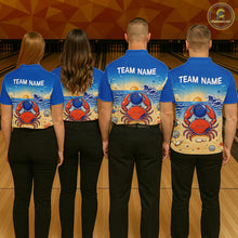 Load image into Gallery viewer, Four people wearing blue bowling shirts with a crab design on a bowling alley.