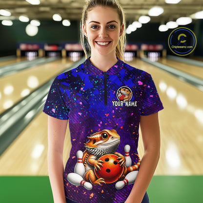 Women’s funny bearded dragon bowling quarter zip shirt, front view on female model in bowling lane 