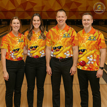 Load image into Gallery viewer, Four people wearing matching orange and yellow bowling shirts with cartoon characters in a bowling alley.