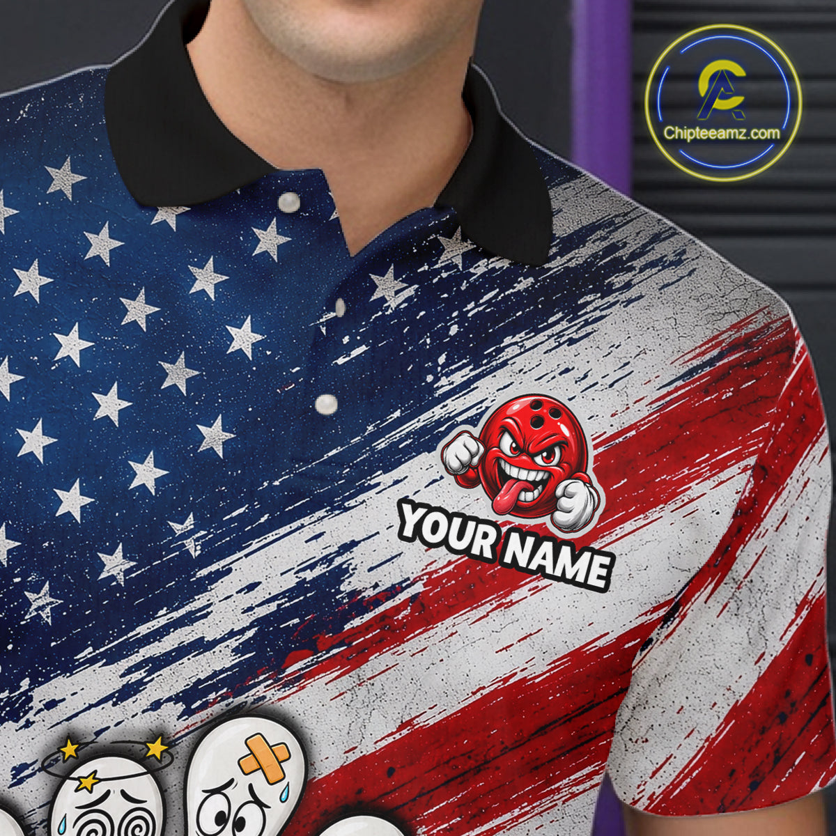 A close-up of a person wearing a short-sleeve polo shirt with a distressed American flag design. The shirt has a black collar, white stars on a blue field, and red and white brushstroke stripes.