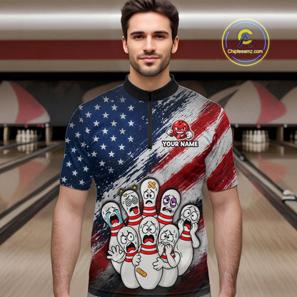 A man wearing a short-sleeve quarter-zip bowling-themed shirt with a distressed American flag design and cartoon bowling pins on the front, standing in a bowling alley. 