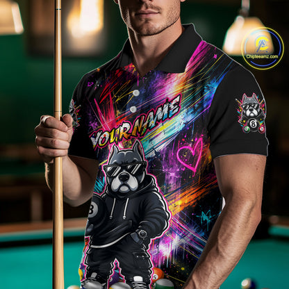 Man holding a pool cue while wearing a vibrant graffiti-style billiards polo with a american bully dog, custom name text, and colorful paint-streak graphics.