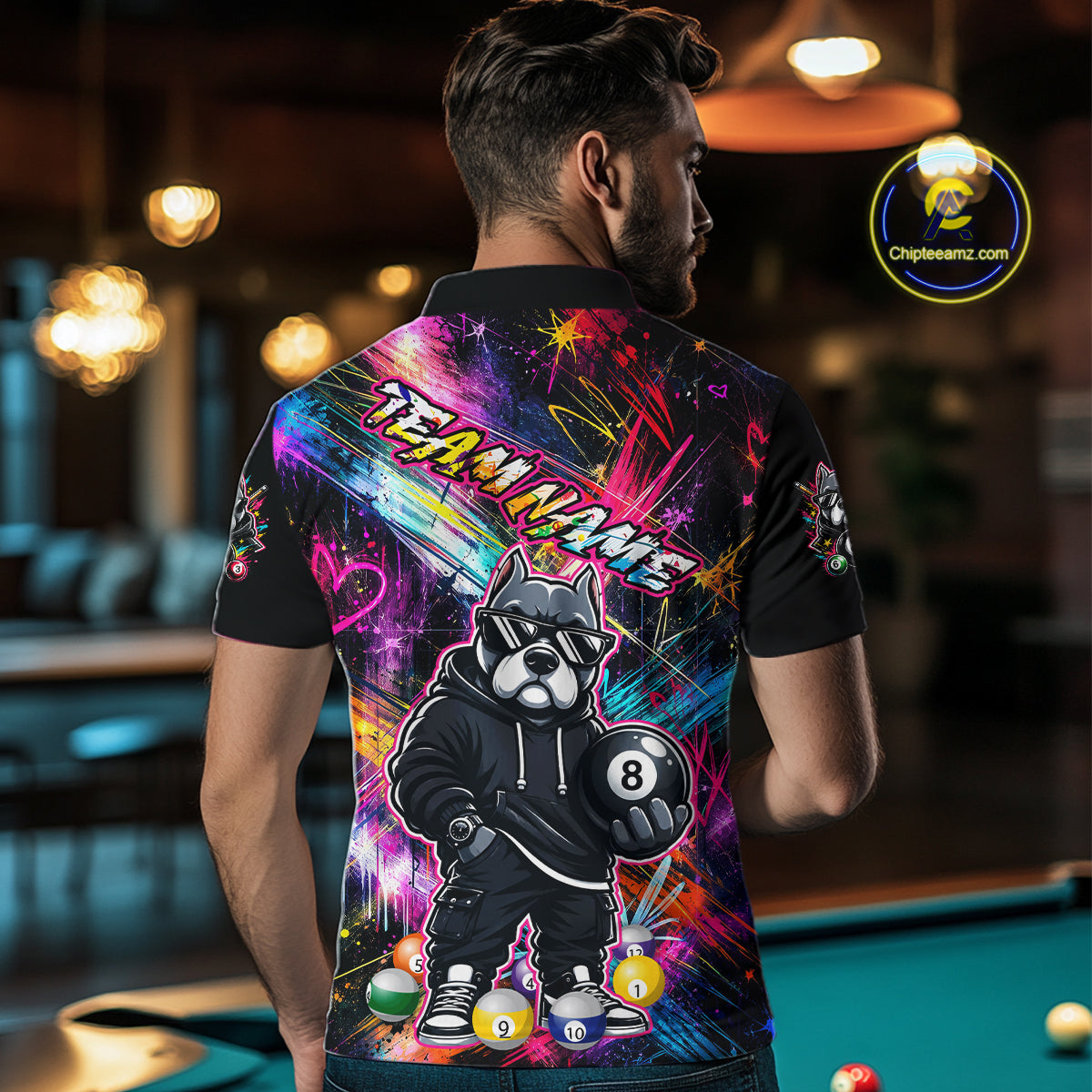 Man wearing a vibrant graffiti-style billiards polo with a american bully dog, custom name text, and colorful paint-streak graphics.