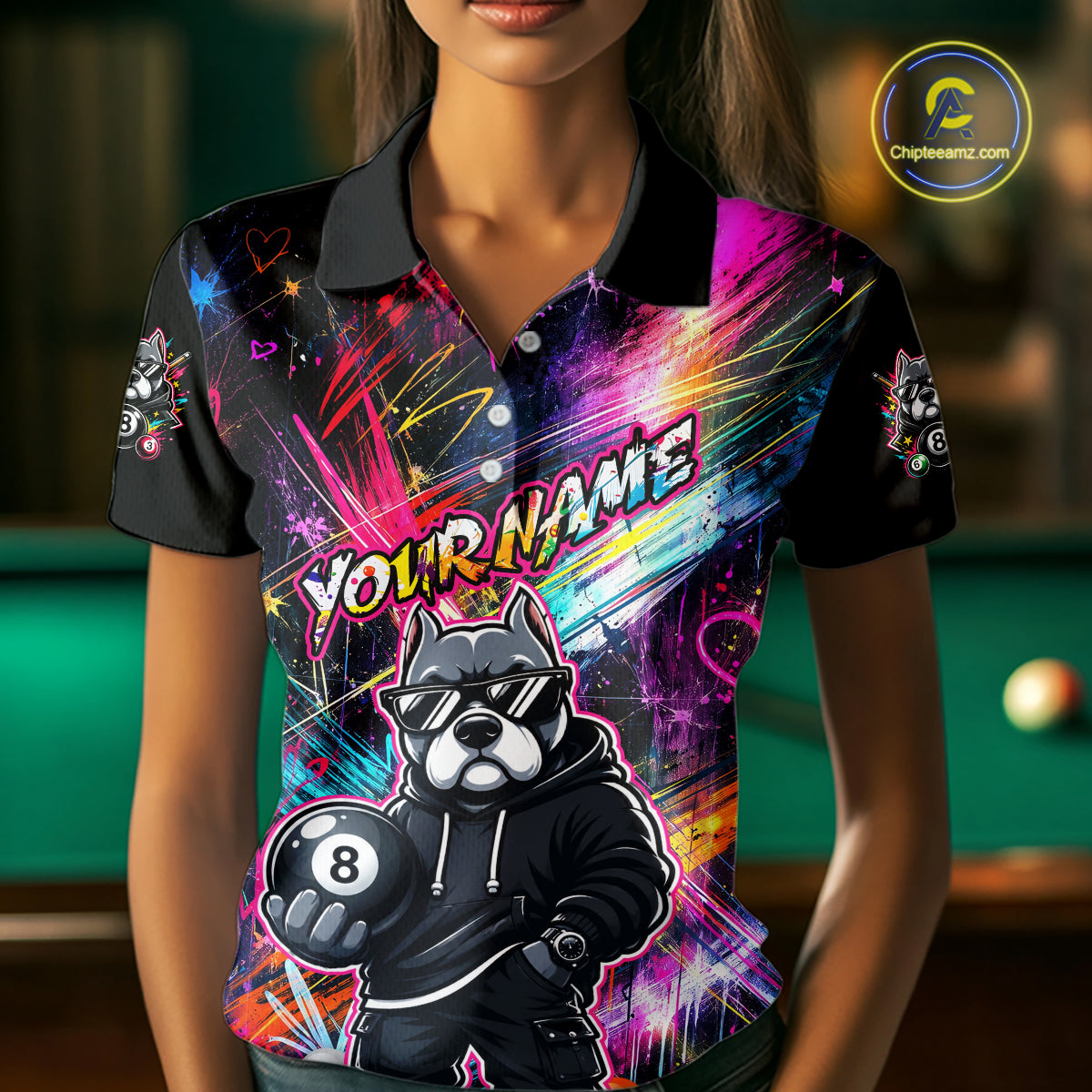 Woman wearing a vibrant graffiti-style billiards polo with a american bully dog, custom name text, and colorful paint-streak graphics.