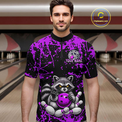 A man wearing a short-sleeve bowling jersey with a black and purple splatter pattern and a large raccoon graphic holding a purple bowling ball. The jersey has a black collar and a white 'YOUR NAME' placeholder print on the chest.