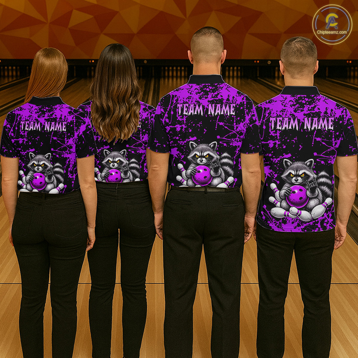 Four people standing with their backs to the camera in a bowling alley, wearing matching black and purple bowling shirts with a raccoon and bowling ball graphic on the back and 'TEAM NAME' printed on the neck.