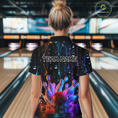 Women wearing a colorful bowling shirt with 'TEAM NAME' text in a bowling alley.