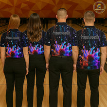 Load image into Gallery viewer, Four people wearing matching bowling shirts with colorful designs and 'TEAM NAME' text at a bowling alley.