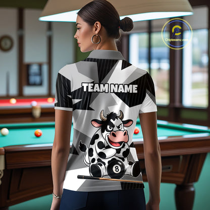 Person wearing a polo shirt with a cow design and 'Team Name' text in a pool hall.