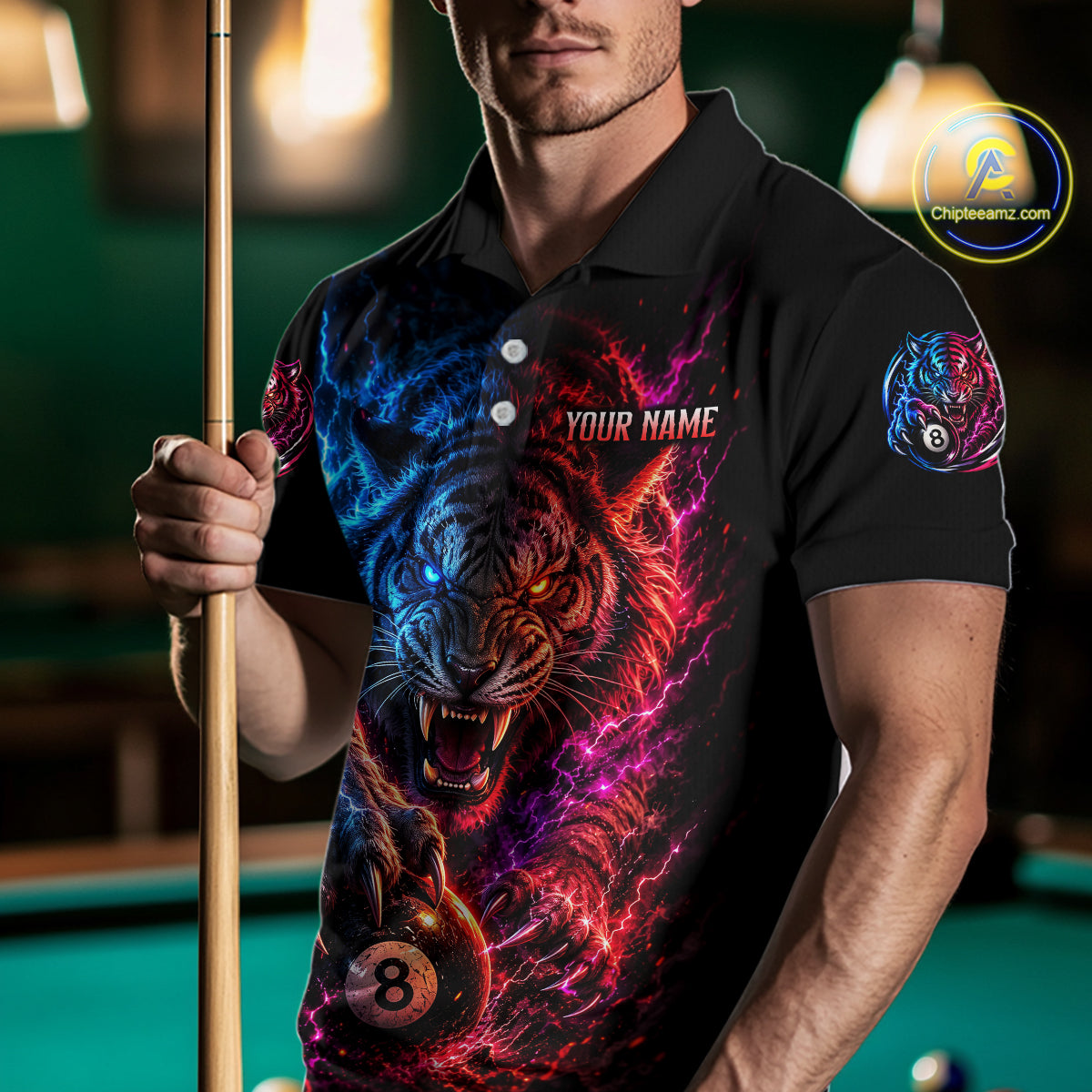 Person wearing a black polo shirt with a colorful tiger design and pool cue in a billiards setting.