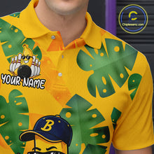 Load image into Gallery viewer, Tropical bowling team shirt in yellow and green tones with personalized chest text, cartoon bowling graphics, and large leaf patterns across the front.