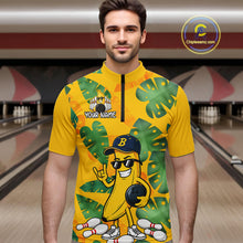 Load image into Gallery viewer, Man in a bowling alley wearing a bright yellow tropical quarter zip shirt with green leaf patterns, custom name text, and a smiling banana mascot holding a bowling ball.