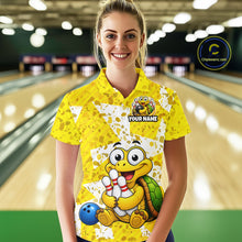 Load image into Gallery viewer, Woman wearing a yellow bowling shirt with cartoon turtle design in a bowling alley.