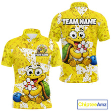 Load image into Gallery viewer, Front and back views of a bright yellow bowling polo shirt with abstract splatter patterns, featuring a cheerful cartoon turtle holding bowling pins and a blue bowling ball graphic.