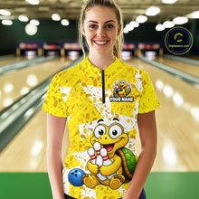 Load image into Gallery viewer, Woman wearing a yellow bowling jersey with cartoon turtle design in a bowling alley.