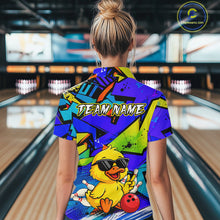 Load image into Gallery viewer, Person wearing a colorful bowling shirt with a duck graphic in a bowling alley.