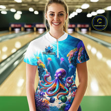 Load image into Gallery viewer, Woman wearing a colorful shirt with an octopus design in a bowling alley.