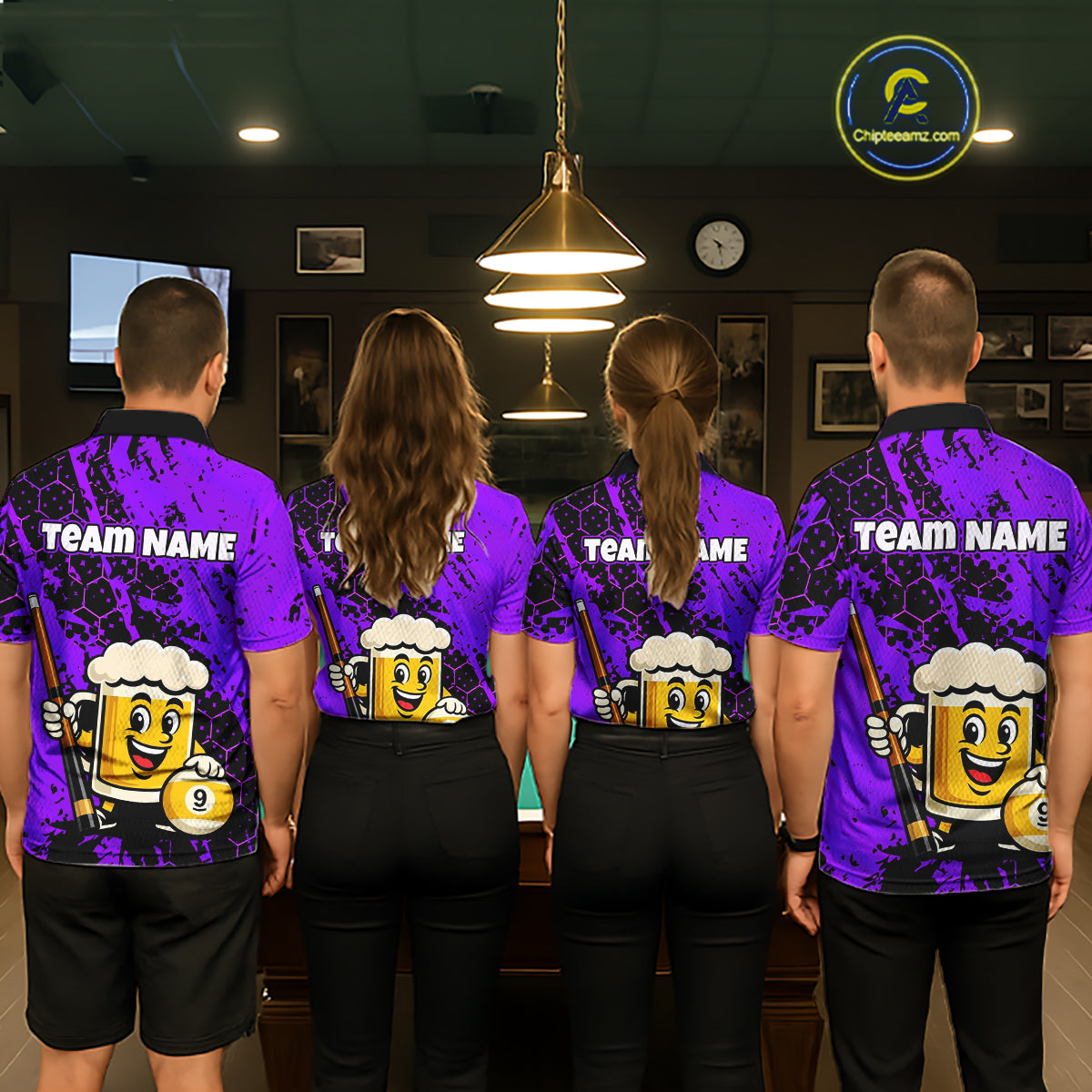 Four people wearing a bright purple billiards polo with black splatter graphics, custom “TEAM NAME” text, and a smiling beer mug mascot holding a pool cue.