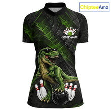 Load image into Gallery viewer, Front bowling quarter zip shirt featuring a dinosaur standing among bowling pins and ball artwork on black green textured background.