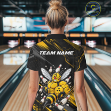 Load image into Gallery viewer, Women wearing bowling polo shirt featuring a muscular bee holding a bowling ball surrounded by pins on black yellow background.