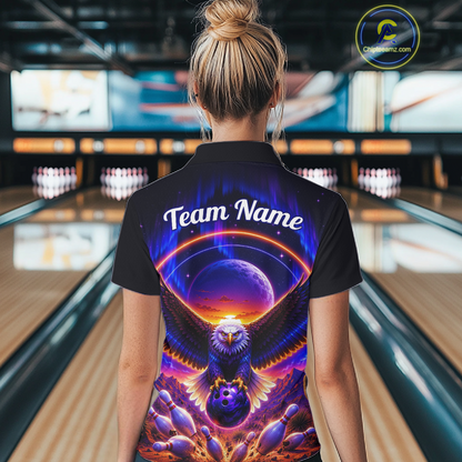Woman wearing a black bowling quarter zip with a eagle, glowing planet backdrop, bowling pins, and custom team and player name text.